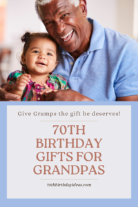 70th Birthday Gifts for Grandpas - Grandfather laughing while holding toddler granddaughter 